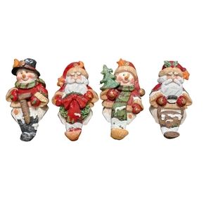 Christmas holiday figurines. Santa Claus Snowman stocking. Holiday decor